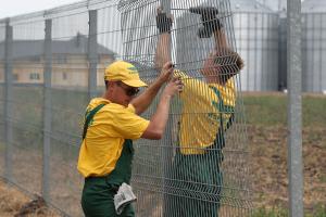 Installing a welded wire grid fence panel